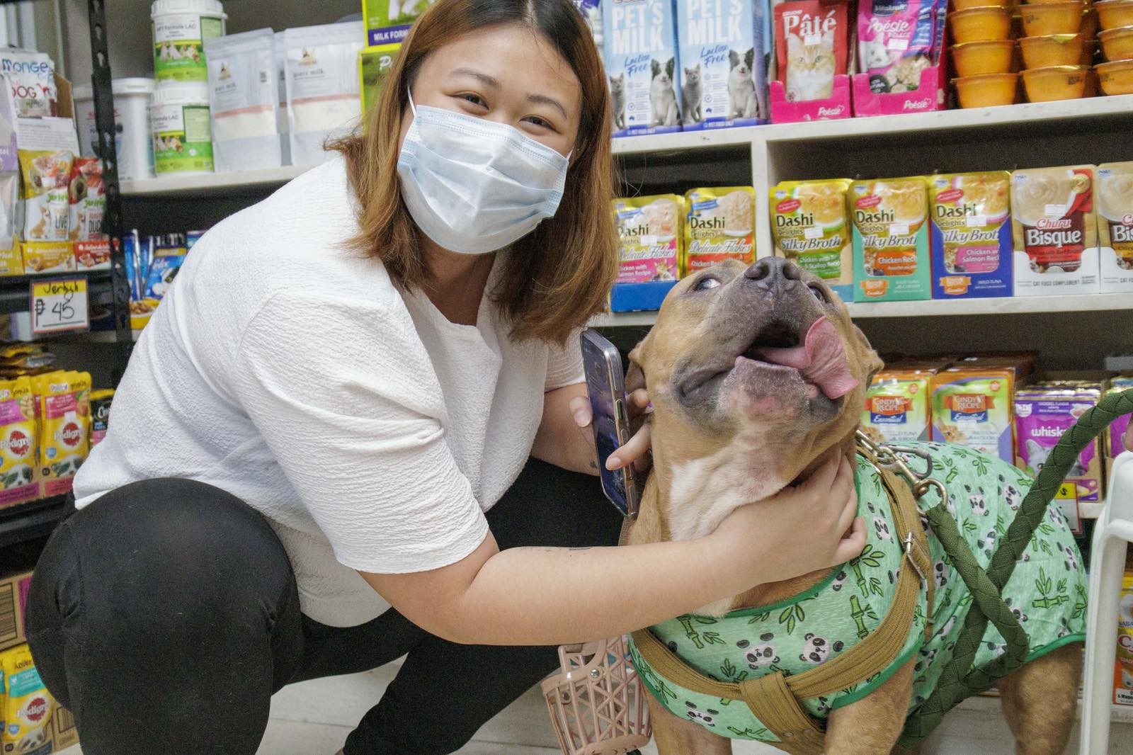 Happy Pet Parent and Dog in Pet Store